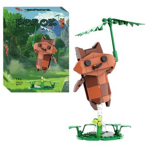 Korok marrom montado com blocos e segurando uma folha, ao lado da caixa, de Zelda Breath of the Wild