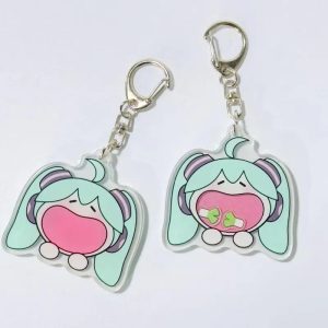 Dois chaveiros de acrílico da Hatsune Miku chibi, de Vocaloid, com mosquetão de metal, em fundo claro