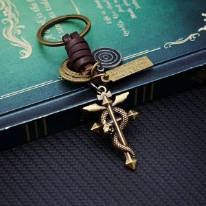 Chaveiro de metal envelhecido com a Cruz de Flamel de Fullmetal Alchemist e tira de couro