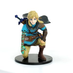 Figure do Link, de The Legend of Zelda, ajoelhado com túnica azul-turquesa e espada nas costas, sobre base preta