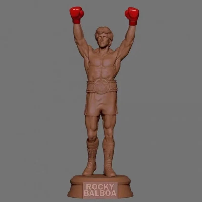 Render do Rocky Balboa de braços erguidos com luvas vermelhas sobre base com o nome Rocky Balboa