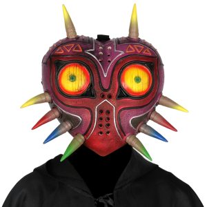 Máscara Majora's Mask de The Legend of Zelda vista de frente, com olhos amarelos e espinhos coloridos