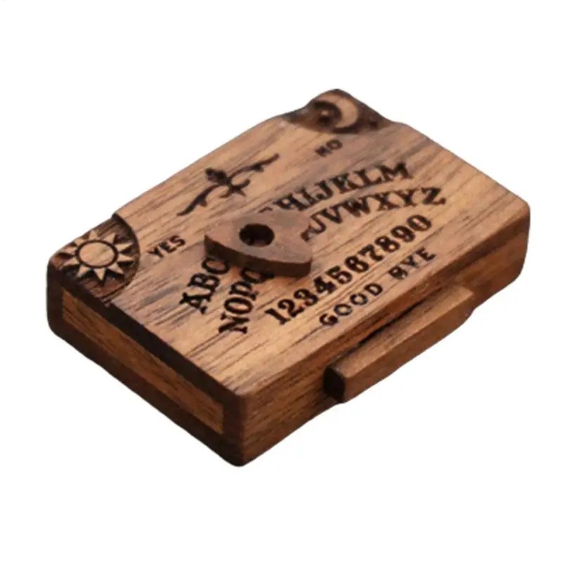 Mini tabuleiro Ouija de madeira com ponteiro no centro, visto de cima