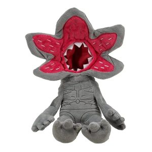 Pelúcia do Demogorgon de Stranger Things, cinza, com a cabeça em pétalas vermelhas, sentada