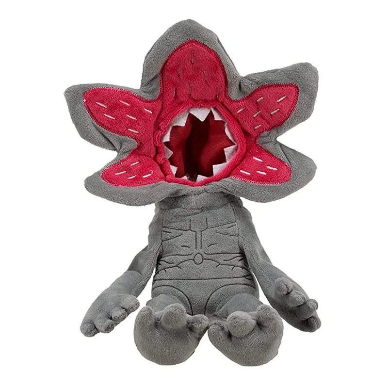 Pelúcia do Demogorgon de Stranger Things, cinza, com a cabeça em pétalas vermelhas, sentada