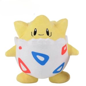 Pelúcia do Togepi, de Pokémon, de frente com casco de ovo e triângulos azuis e vermelhos