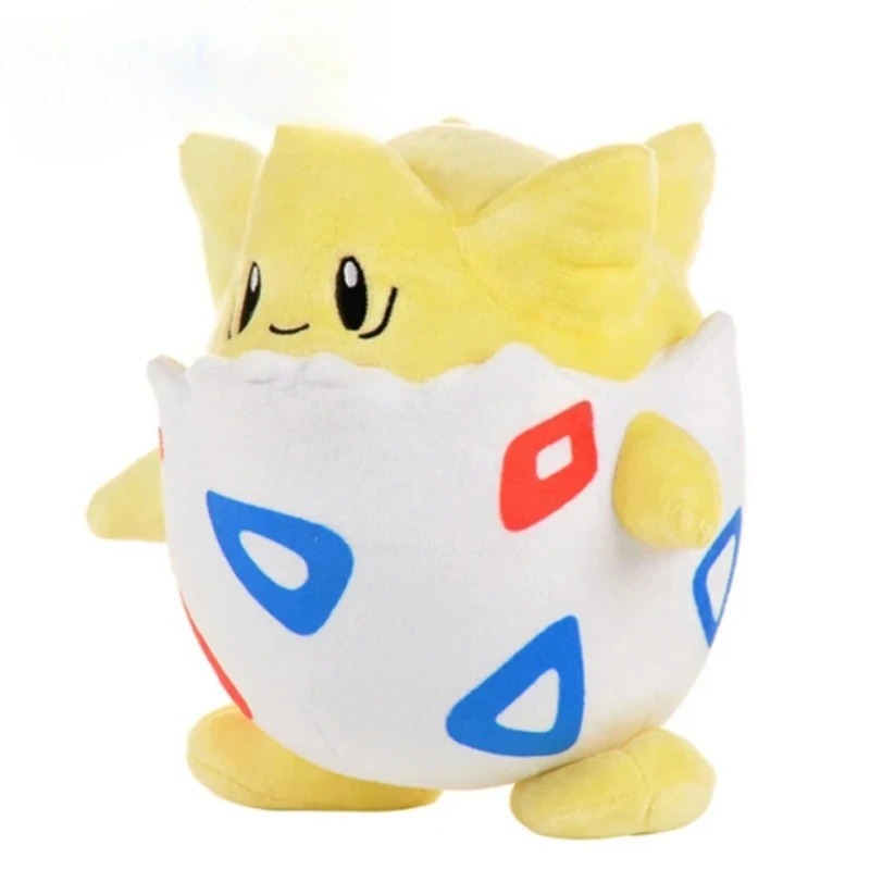 Pelúcia do Togepi, de Pokémon, em três quartos mostrando o casco e a cabeça amarela