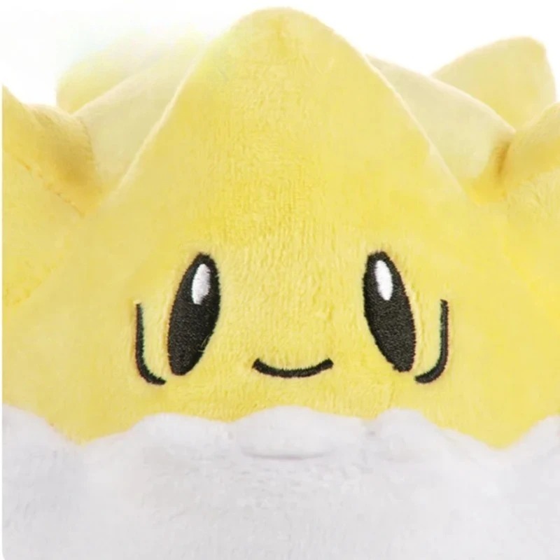 Detalhe do rosto bordado da pelúcia do Togepi, de Pokémon