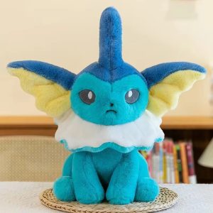Pelúcia do Vaporeon, de Pokémon, de 42 cm, azul-turquesa com gola branca, sentada sobre uma esteira