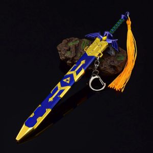 Réplica da Master Sword de Zelda com bainha azul e dourada e borla laranja sobre fundo preto